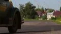 Pre-war vintage car Packard Convertible passing through camera HD Footage