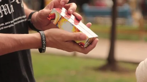 Preacher man sharing evangecube at a park in Cali Stock Footage 54412497