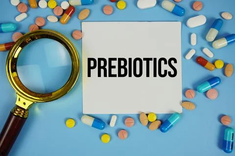 Prebiotics text on sticky note paper with Medicine and Maginfying glass on .. Stock Photos