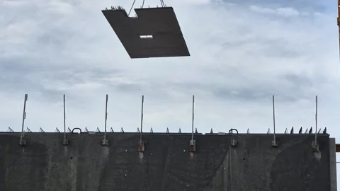 Precast concrete floor panel hoisted in rain slow motion 動画素材 342049828