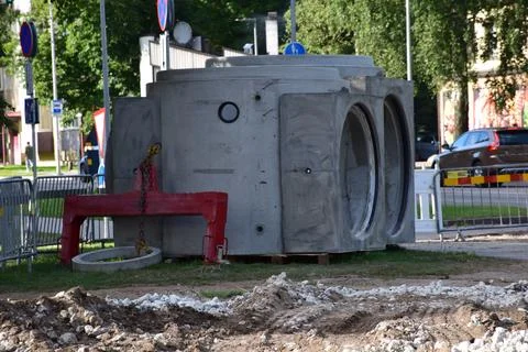 Precast Concrete Manhole Structures and Lifting Beam at Roadwork Site Stock Photos