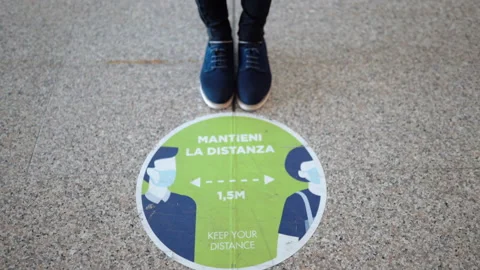 Precautionary measures on the streets of Rome, round warning sign on pavement Stock Footage 142315643