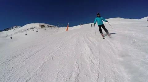 Preceding Skier on ski run at speed, 4K gimbal stabilised Stock Footage 53433462