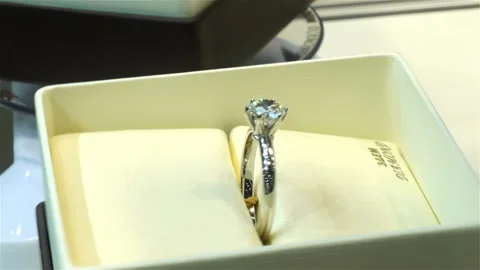 Precious diamond ring in a box rotates Stock Footage 139869470