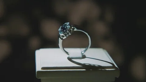 Precious diamond rings. Fine luxury diamond jewellery window display with ring Stock Footage