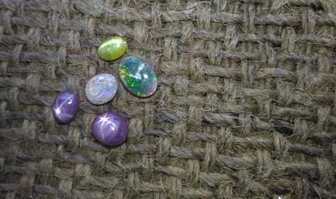 Precious Gemstones on jute Stock Photos