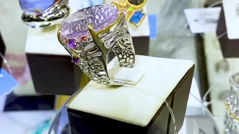 A precious huge ring made of silver or white gold with a pink gemstone Stock Footage 170723514