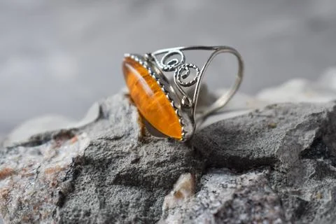 A precious ring with amber on a stone. macro Stock Photos