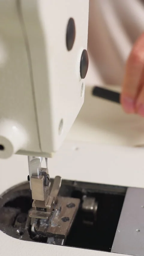 Precise adjustment of tension and thread on sewing device, Close depiction of Stock Footage 333638975