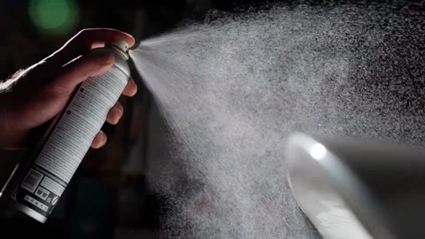 Precise application of spray from aerosol can in auto body shop, capturing a Stock Footage 269226613
