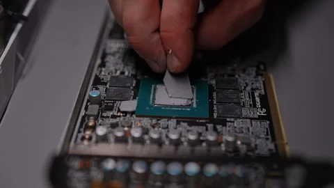 Precise application of thermal paste to graphics processing unit chip for Stock Footage 290927311