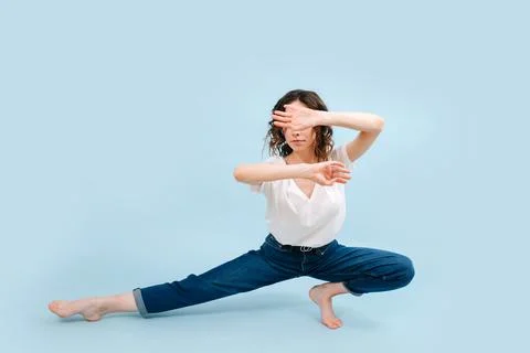 Precise contemporary dancer lowered with forearms parallel, one above the oth Stock Photos