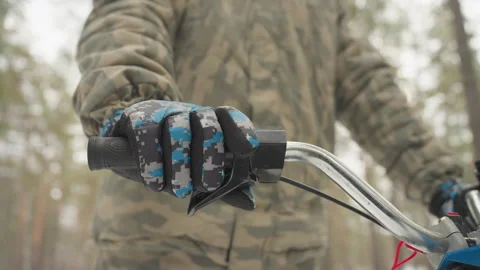 Precise control in forest terrain. Focused grip on offroad ATV throttle. Close Stock Footage 337821863