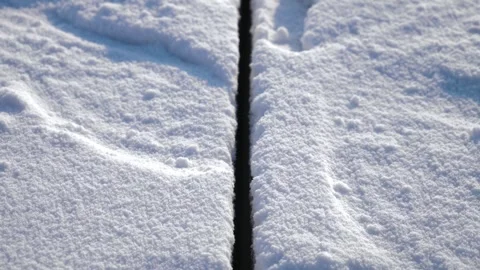 Precise cut line in thick ice, created by an industrial cutting machine on the Stock Footage 301069811