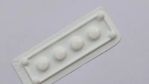 Precise detail of the medicine in tablet form, white packaging that inspire.. Stock Footage 260823084