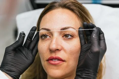 Precise eyebrow design, premicroblading thread marking technique Stock Photos