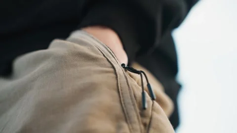 Precise hand positioning in action. Focused hand operating zipper with intent Stock Footage 345153722