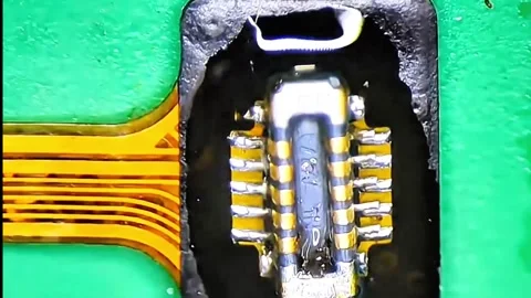 Precise Soldering of FPC Connector on Smartphone Charging Ribbon Stock Footage 333610558