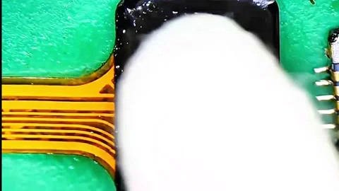 Precise Soldering of FPC Connector on Smartphone Charging Ribbon Stock Footage 333610561