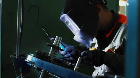 Precise welding process, operator performs detailed metal welding task Stock Footage 320013374