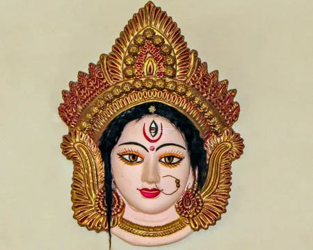 Precisely crafted, painted and decorated face of Godess Durga. Stock Photos