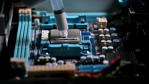 Precision Application of Thermal Paste on a Computer CPU in a High-Tech Rep.. Stock Footage 311776155