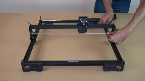 Precision Assembly of Laser Engraver Showing Craft and Skillful Setup Stock Footage 328293313