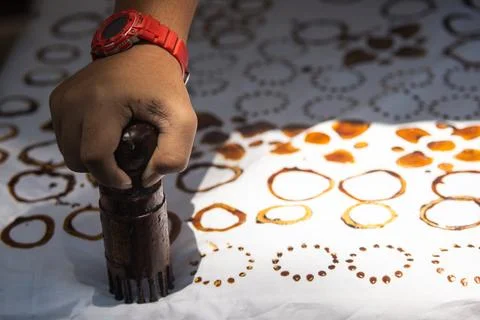 Precision Bamboo Batik Stamping Process Featuring Wax Patterns On White Fab.. Stock Photos