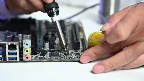 Precision closeup of soldering a circuit board. Ideal for themes on electro.. Stock Footage 312773736