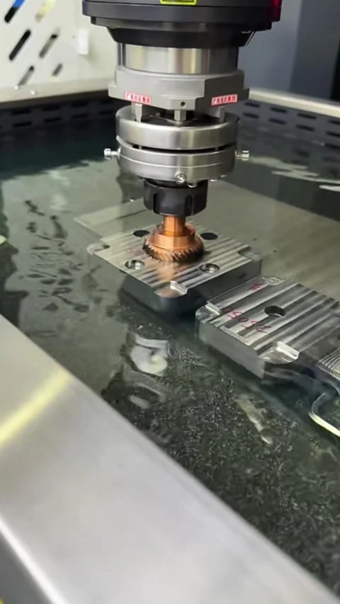 Precision CNC EDM Metal Processing of Copper Gear in China. Stock Footage 330379348