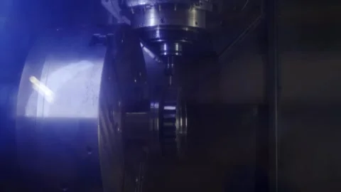 Precision CNC machine carves metal part in industrial workspace. Automated Stock Footage 273849893