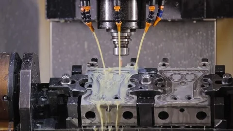 Precision computer numerical control machinery tool spindle moving down toward Stock Footage 336813460