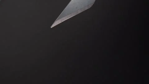 Precision Craft Knife Blade on Black Surface. Stock Footage 288044543