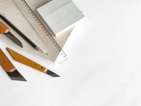 Precision crafting tools set on white surface with measurement ruler and wooden Stock Photos