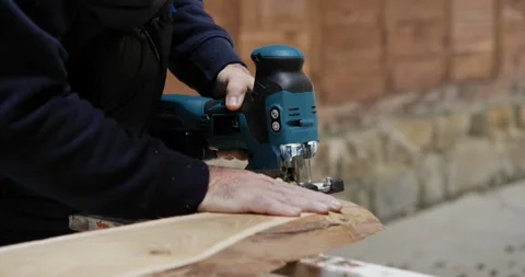 Precision Cutting: Jigsaw in Hand Stock Footage 327810863