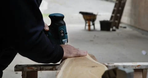Precision Cutting: Jigsaw in Hand Stock Footage 327810930