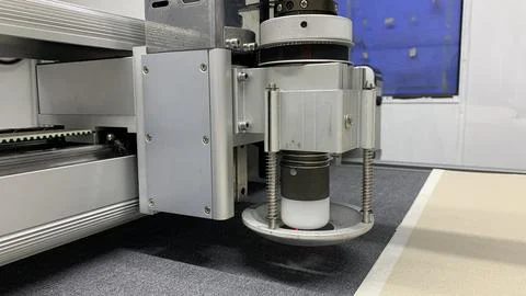 Precision cutting machine slicing through material Stock Photos