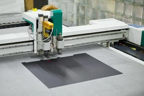 Precision cutting process using an industrial large-format CNC plotter for Stock Photos