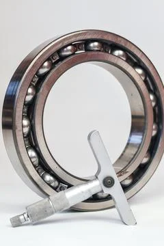 Precision depth micrometer measuring a ball bearing isolated on white backg.. Stock Photos