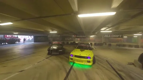 Precision Drift Battle: Black BMW with Orange Wheels vs Black-Yellow BMW Stock Footage 327034648