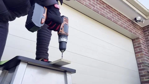 Precision drilling on ladder Stock Footage 321228386