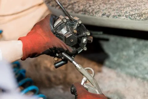 Precision Engineering in Action: A Technician Repairing a Motor Component Stock Photos