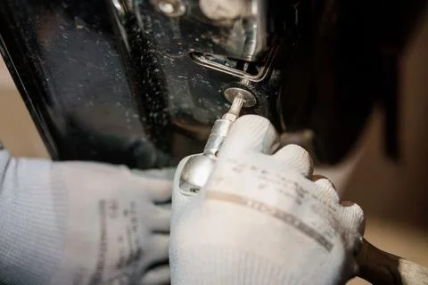 Precision Engineering: A Close-Up of Hand Using a Screwdriver in a Mechanic.. Stock Photos