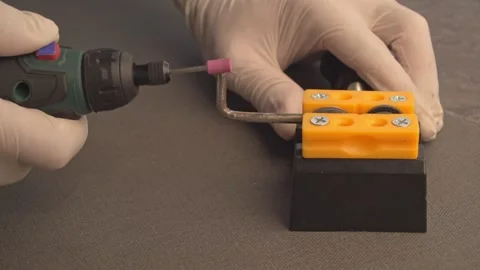 Precision Grinding of Metal Component with Rotary Power Tool Stock Footage 328650006