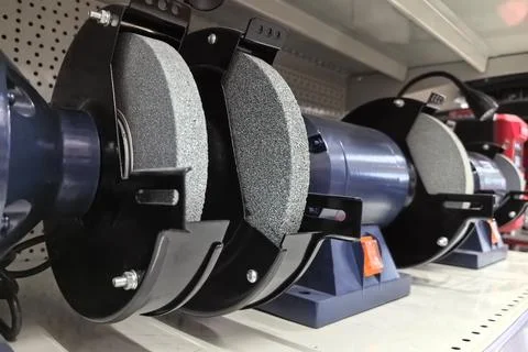 Precision grinding tools lined up on a store shelf in the hardware section Stock Photos