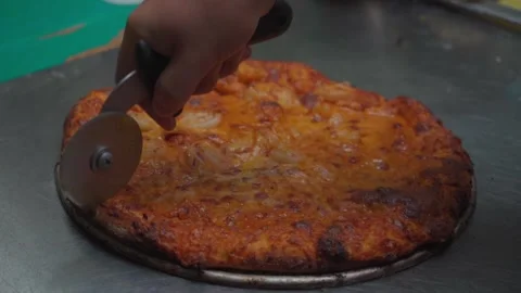 Precision in the Kitchen: Pizza Cutter in Action Stock Footage 293262009