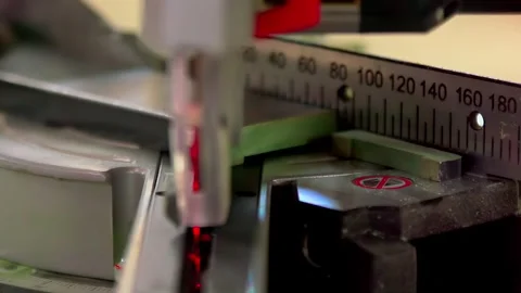 Precision Laser Cutting on Metal Surface with Measuring Scale Stock Footage 332676878