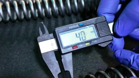 Precision measurement, Use Digital Caliper to Measure metal Coil Spring Stock Footage 320923324