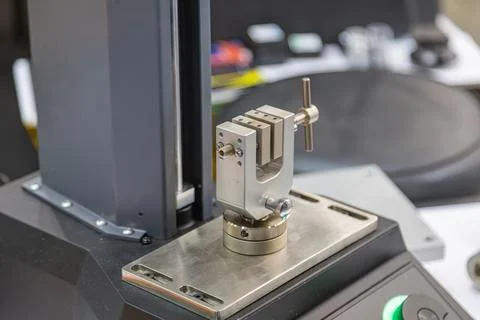 Precision mechanical specimen vise clamp mounted on an industrial testing mac Stock Photos