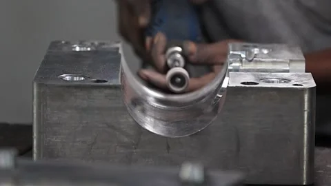 Precision meets expertise as an operator skillfully operates a manual Stock Footage 250127330